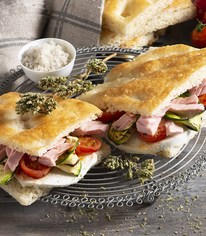 Focaccia filled with tuna, sautéed cherry tomatoes and grilled courgettes